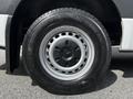 Close-up of a 2020 Mercedes-Benz Sprinter wheel featuring a black alloy rim and a rugged tire designed for all weather conditions