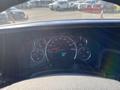 Dashboard of a 2012 GMC Savana showing speedometer fuel gauge and other dials