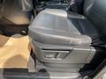 Black leather seat of a 2006 Land Rover LR3 featuring a worn spot and electronic controls on the side