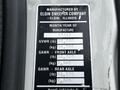 A detailed label from a 2012 Autocar Xpert with specifications on weight capacities and manufactured by Elgin Sweeper Company