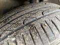 Close-up of a worn tire tread showing dirt and wear on a 2005 Chrysler PT Cruiser tire