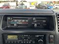 Dashboard controls of a 2004 Toyota Toyoace featuring air conditioning and ventilation settings