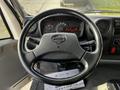 The interior view of a 2015 Hino 195 showing the steering wheel dashboard gauges and control buttons