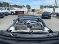 A 2007 Chrysler PT Cruiser with a convertible top down showing the interior seating and dashboard