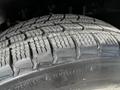 Close-up of a treaded tire from a 2010 Ford Ranger showing detailed patterns for traction and grip