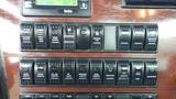 Control panel of a 2019 Western Star Trucks 4900 featuring various switches for engine brake cruise control lights and other vehicle functions