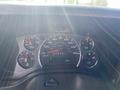 Dashboard of a 2020 Chevrolet Express featuring speedometer fuel gauge and temperature indicators with a digital display showing 30 degrees Celsius
