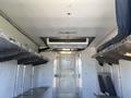 Interior of a 2019 Freightliner MT45 featuring shelves on either side and an overhead air conditioning unit