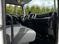 Interior view of a 2020 Hino 338 featuring driver's seat and dashboard with controls and a mounted device on the console