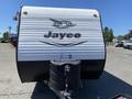 A 2016 Jayco 265RLSW travel trailer with a sleek design and prominent Jayco logo on the front side