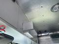 Interior view of a 2007 Morgan Olson Workhorse W42 with metal components and light fixtures visible on the ceiling and walls