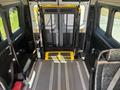 Interior of a 2016 RAM Promaster with a wheelchair ramp folded out and secure storage area visible on the left side