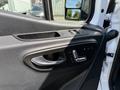Interior door panel of a 2019 Mercedes-Benz Sprinter featuring controls for windows and locks