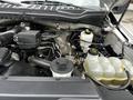 Engine compartment of a 2020 Ford F-350 SD featuring various components such as reservoirs hoses and wiring without visible signs of wear or damage