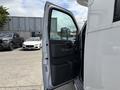 A 2020 Chevrolet Express van with the driver's side door open showcasing the interior door panel and handle