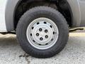 Close-up of a 2017 RAM Promaster wheel with a silver rim and a rugged Goodyear tire showcasing deep treads