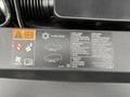 2016 GMC Sierra 1500 engine compartment with labels for maintenance specifications and fluid types