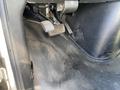 The interior of a 2020 Chevrolet Express showing the driver's footwell with a visible brake pedal and floor mat