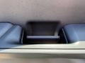 Interior door handle of a 2023 Ford F-550 in a sleek design with a textured surface and a matte finish