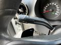A close-up of the turn signal lever inside a 2020 Mercedes-Benz Sprinter dashboard with a speedometer displayed in the background