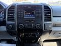 Dashboard of a 2019 Ford F-350 SD featuring a multimedia display with radio and climate control buttons