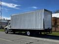 A 2016 Freightliner M2 106 box truck with a large white cargo area viewed from the side