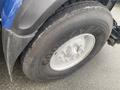 Close-up of a tire on a 2016 International 7400 featuring a Goodyear tire brand with a metallic wheel hub and multiple lug nuts visible