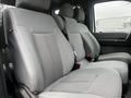 The interior of a 2015 Ford F-550 featuring gray fabric seats with a textured pattern designed for comfort and utility