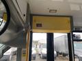 Interior view of a 2017 Chevrolet Express showing a yellow overhead panel with a small display and reflective surfaces