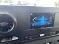 2022 Mercedes-Benz Sprinter dashboard featuring a touchscreen display with phone and radio options and an air vent on the side