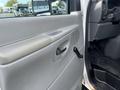 Interior view of a 2008 Ford Econoline door panel showing the handle and window crank