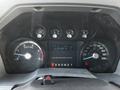 Dashboard of a 2011 Ford F-450 SD showing speedometer fuel gauge trip information and warning lights