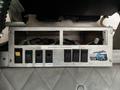 Control panel with multiple switches labeled for dome light beacon and flasher features on a 2006 GMC C5000 vehicle