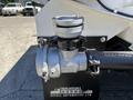 A close-up of a valve on a 2019 Ford F-750 showing metallic components with visible branding and detailed markings on the body of the valve