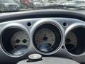 Dashboard of a 2005 Chrysler PT Cruiser displaying speedometer fuel gauge and tachometer