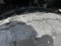Close-up of a treaded tire from a 2010 Freightliner M2 106 showing wear and texture details