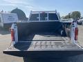 A 2017 Ford F-150 truck with an open bed showing a metal bed liner and a rack attached to the cab