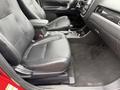 Interior view of a 2016 Mitsubishi Outlander showing two black fabric seats with armrests and controls between them