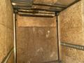 2020 Stealth Enterprises Trailer interior view with wood-paneled walls and metal tracks visible