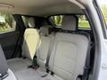 Interior view of a 2020 Ford Escape showing the backseat with two headrests and seatbelts in a light gray fabric upholstery
