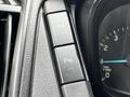 Close-up of a dashboard control panel in a 2017 Ford Transit 350 featuring buttons for TCS and a warning indicator