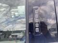 A 2017 Ford F-550 door with a keypad for keyless entry displaying numbers 1 through 9