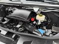 A 2019 Mercedes-Benz Sprinter engine compartment showcasing the air intake system battery and coolant reservoir with various hoses and components