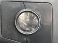 Fuel gauge of a 2008 Ford F-550 showing the needle between half and full tank levels with a visible crack on the surrounding panel