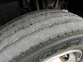 Close-up of a worn tire from a 2013 Hino 195 showcasing the tread patterns and signs of wear