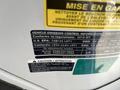 2019 Nissan NV200 vehicle emission control information label with details on compliance regulations and fluid caution warnings