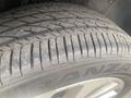 Close-up of a worn tire from a 2018 Buick Encore showing tread patterns and branding on the sidewall
