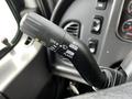 Close-up of a multifunction lever in a 2012 Freightliner M2 106 truck featuring controls for wipers and turn signals
