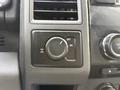 A control switch panel from a 2017 Ford F-350 SD featuring an adjustable dial labeled with off and on settings