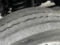 Close-up of the tire tread on a 2011 Ford F-550 showing worn patterns and debris on the surface